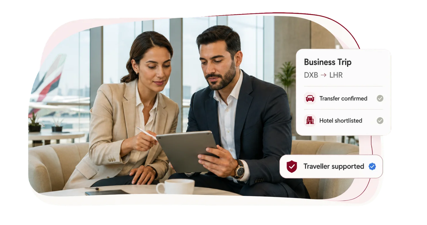Business travelers reviewing a confirmed trip itinerary